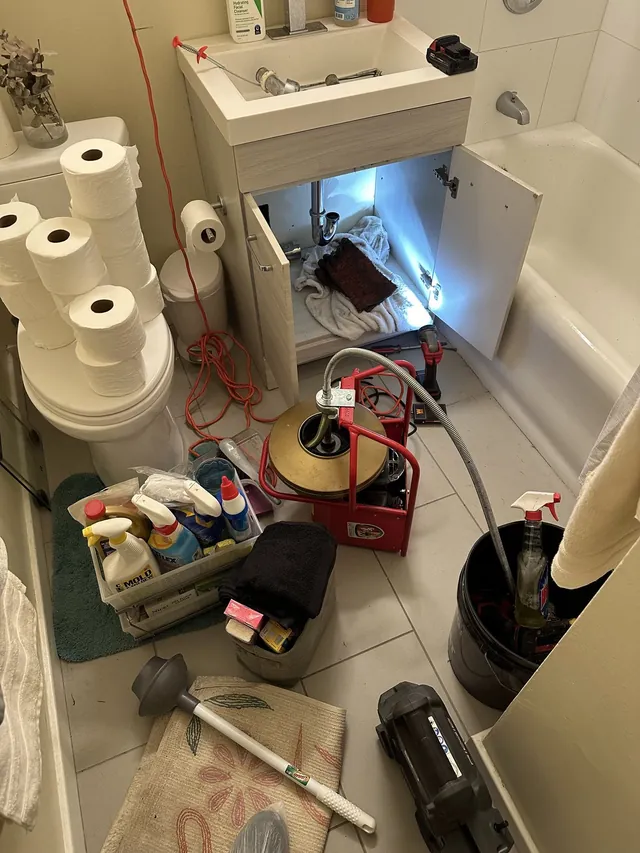 Sink drain repair under cabinet