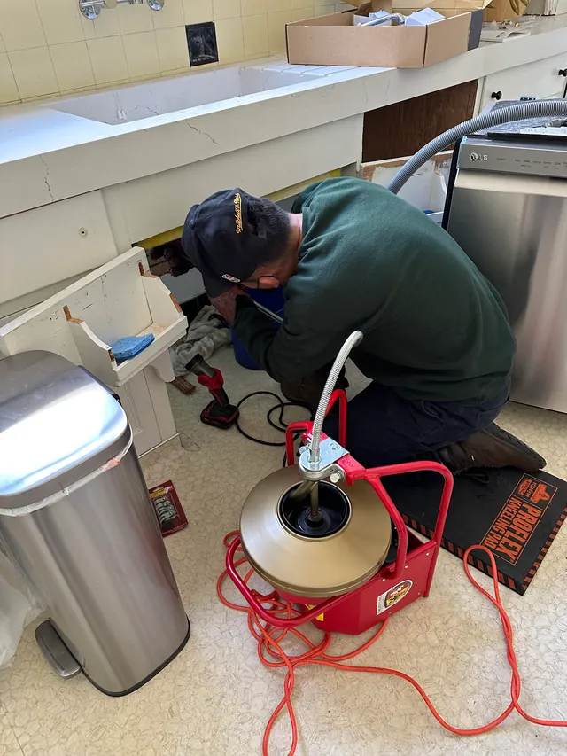 Drain cleaning with professional auger