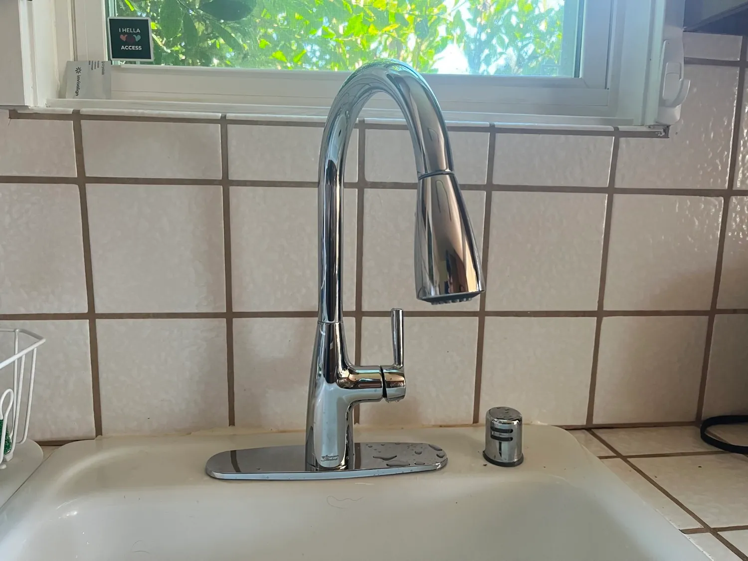 Foster City plumber repairing a kitchen faucet — ASAP Plumbing Pros