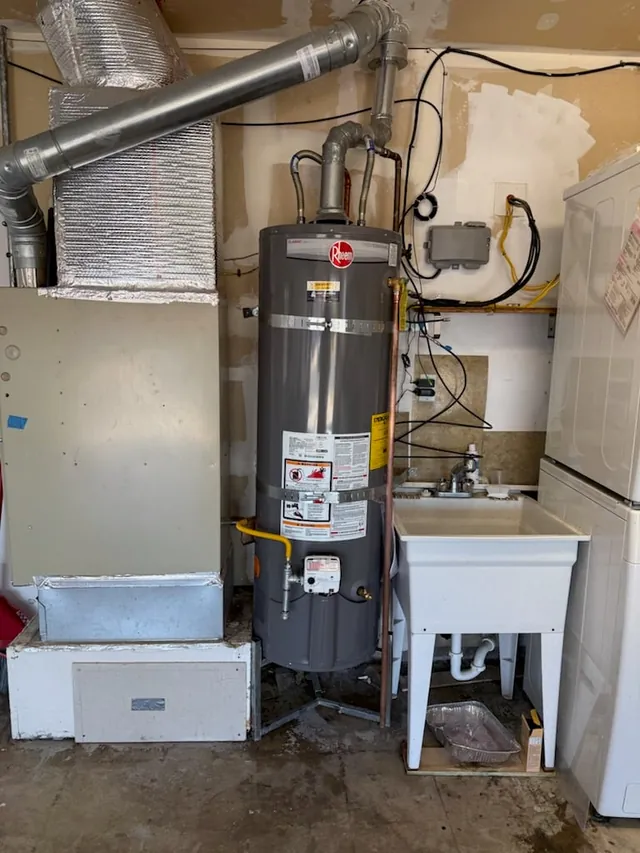 Rheem water heater install in a residential utility room